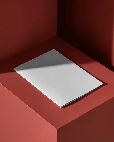 modern-brochure-mockup-on-bold-red-surface-under-sharp-contrasting-shadows