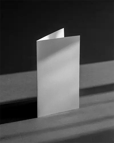 clean-folded-brochure-mockup-showcasing-realistic-paper-texture-and-natural-light-shadow-emphasis