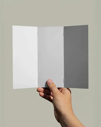 Tri Fold Brochure Mockup Held In Hand With Soft Shadows And Simple Background