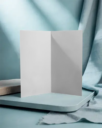 Empty Paper Brochure Mockup Standing Upright On Modern Textured Platform Display