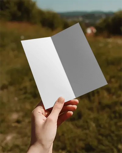 Outdoor Brochure Mockup With Hand Gripping Open Folded Paper For Presentation