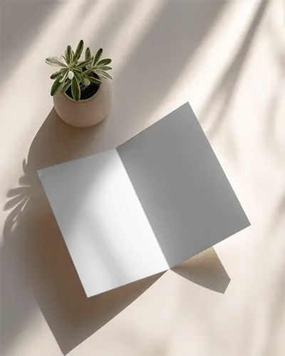 Sleek Minimalist Folded Brochure Mockup On Textured Background With Natural Lighting Effects