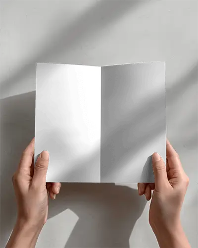 Hand Holding Opened Brochure Mockup With Minimalist Background Light Shadow Effect