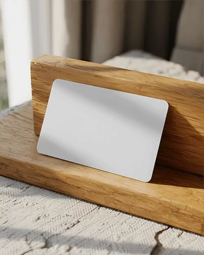 rounded-business-card-mockup-resting-on-textured-wood-stand-for-marketing-materials