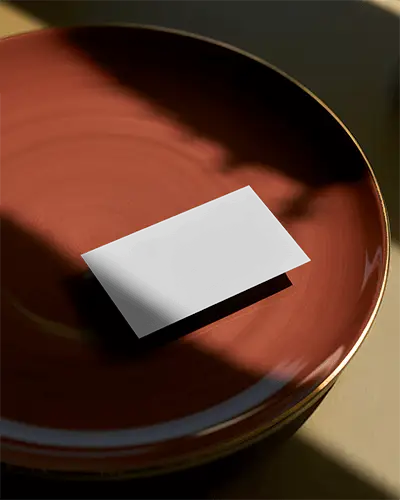 elegant-business-card-mockup-showcased-on-polished-plate-with-soft-shadow-and-light-design