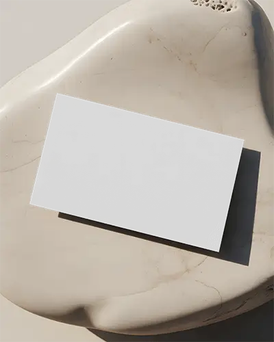 sleek-simple-business-card-mockup-floating-on-fine-grained-marble-texture-surface