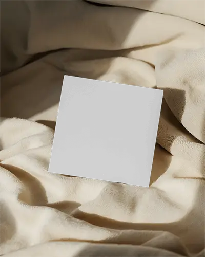 square-business-card-mockup-with-soft-fabric-background-and-natural-light-shadows