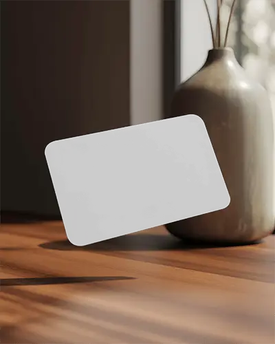 floating-minimalist-business-card-mockup-on-wooden-table-with-decorative-vase-background