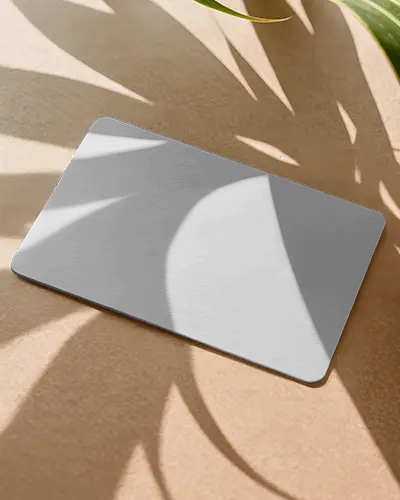 Tropical Business Card Mockup On Sandy Surface With Sunlight And Large Plant Leaf Shadows