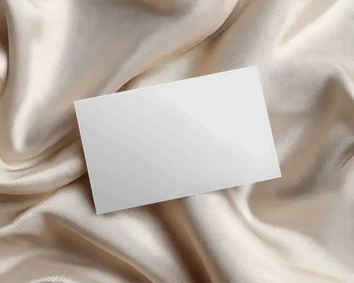 Premium Business Card Mockup Floating On Sleek Satin Fabric Background For Design Presentation