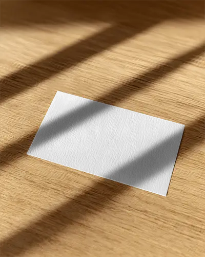 Detailed Closeup Business Card Mockup With Wood Grain Background And Light Play