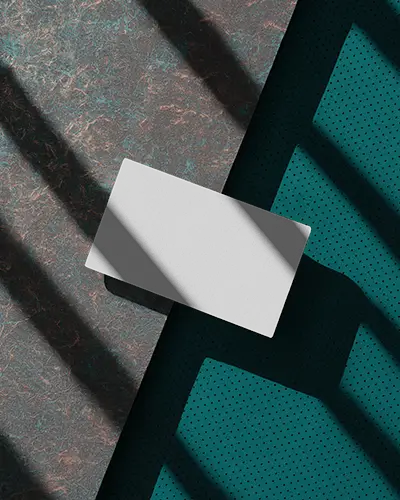 Angled Business Card Mockup On Textured Teal Surface Creative Light Shadow Modern Look