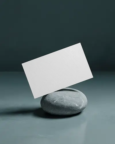 Stone Balance Horizontal Business Card Mockup Card Resting Diagonally On Grey Rock