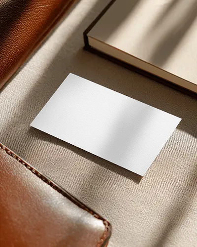 Premium Leather And Book Desk Textured Business Card Mockup In Sunlit Elegant Workspace