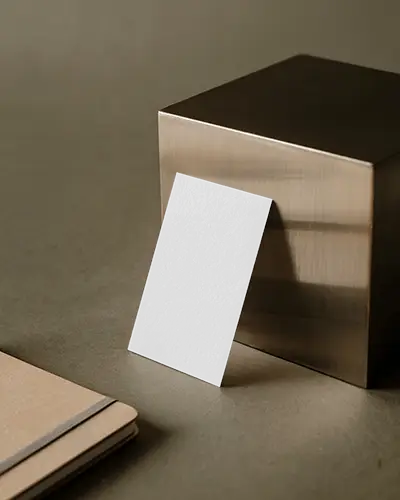 Vertical Business Card Mockup Against Golden Cube Elegant And Professional Office Style