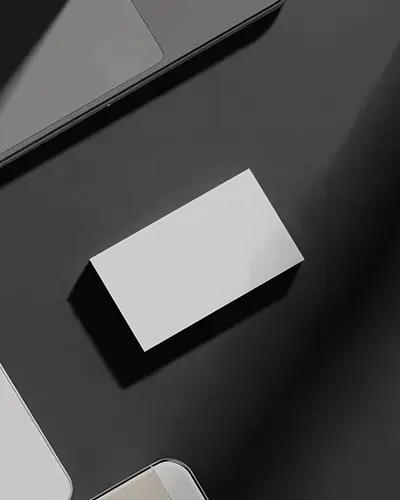 Sleek Horizontal Business Card Mockup On Black Desk With Modern Tech Gadgets Minimal Dark Workspace
