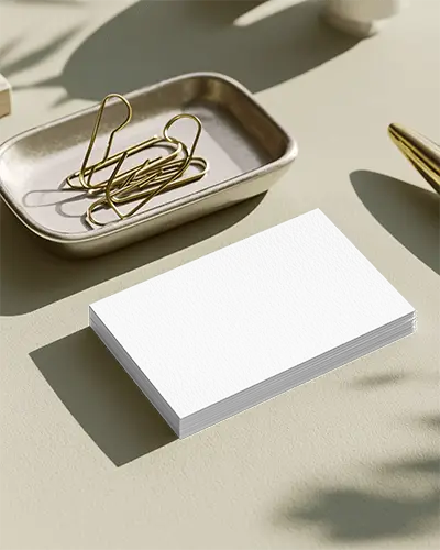 Realistic Clean Business Card Mockup On Flat Surface With Subtle Shadows And Golden Paperclips