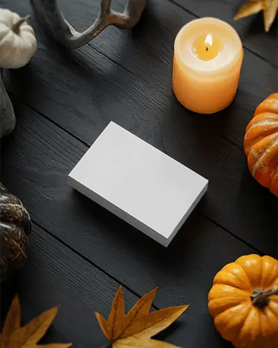 Halloween Card Mockup On Black Table With Candles Pumpkins And Maple Leaves