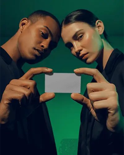 Professional Business Card Mockup With Two People Holding A Blank Card Up Close