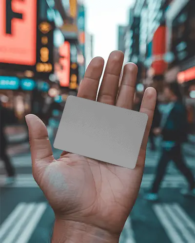 Hand Holding Blank Business Card Street Background Urban Busy Crosswalk Scene