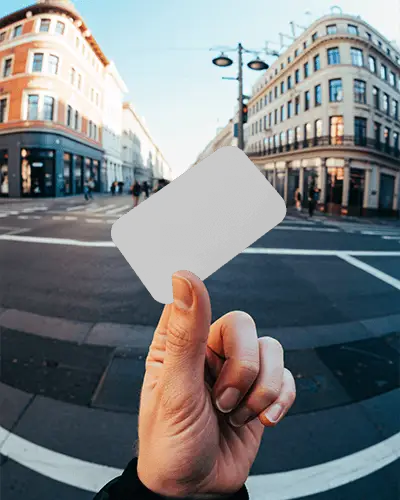 Hand Holding Blank Business Card Mockup On Urban Street For Professional Branding Presentation