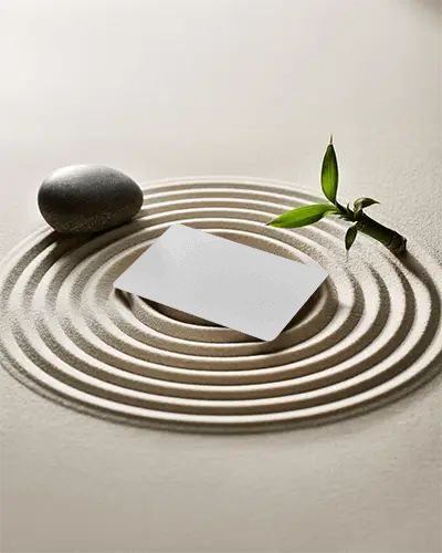 zen-garden-business-card-mockup-placed-in-sand-circles-with-stone-and-bamboo-detail