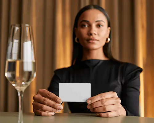 Woman Holding Minimalist Business Card Mockup With Elegant Indoor Background For Showcase