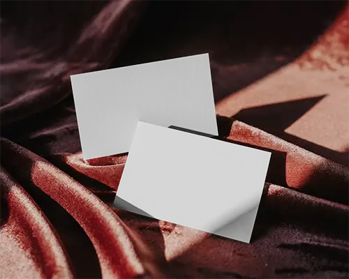 Professional Business Card Mockup Showcasing Clean Cut Edge On Smooth Cloth Surface