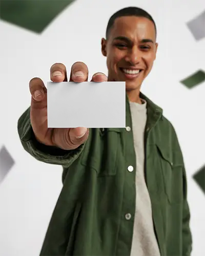 Smiling Man Holding Business Card Mockup For Professional Brand Presentation