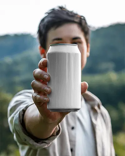 Outdoor Can Mockup Held By Man In Natural Scenic Background Close Up Focus On Metal Surface