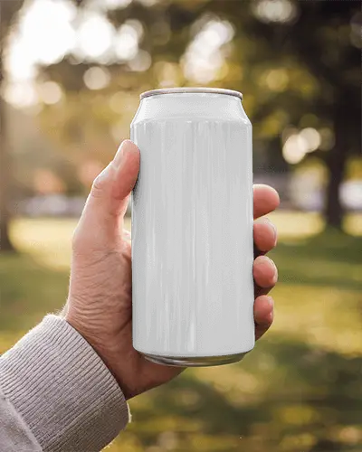 Outdoor Park Can Mockup In Hand During Golden Hour Light With Warm Bokeh And Casual Ambience