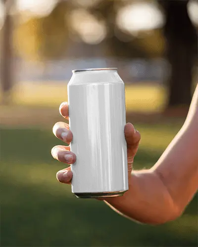 Can Mockup Held Mid Air In Evening Park Lighting With Sunset Tone And Natural Hand Positioning