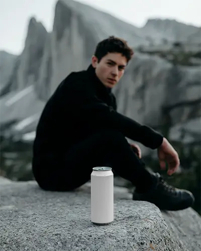 Realistic Cold Beverage Can Mockup In Mountain Setting For Product Promotion Ideas