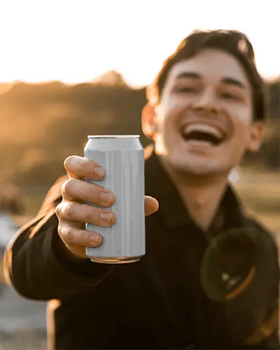Joyful Outdoor Can Mockup Happy Man Holding Drink In Sunset Golden Hour Lighting