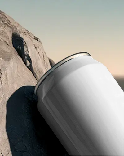 Sleek Aluminum Beverage Can Mockup On Natural Rock Background For Label Design