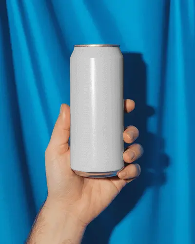 Hand Holding Sleek Metal Beverage Can Over Vibrant Textured Background For Design