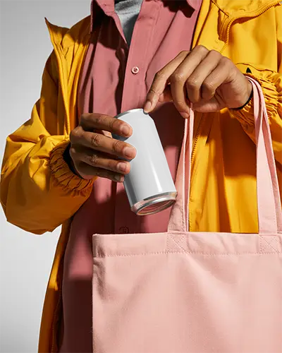 Person Holding Can Mockup With Reusable Tote Bag Showing Product Placement