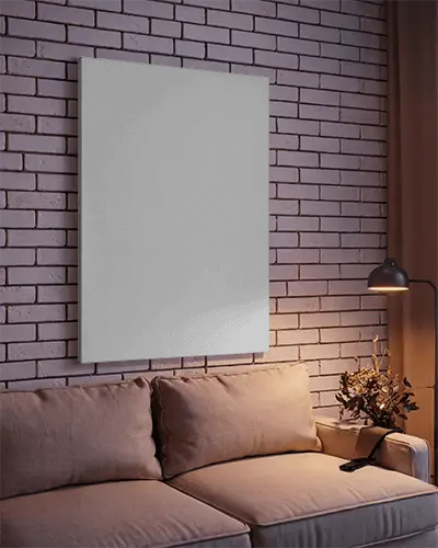 vertical-canvas-frame-mockup-hanging-on-brick-wall-above-comfy-sofa-lamp-and-dried-flowers