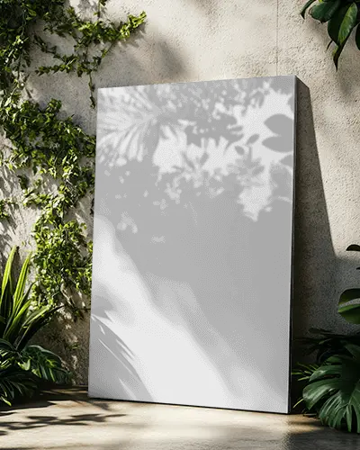 vertical-canvas-mockup-against-textured-wall-with-surrounding-plants-nature-theme