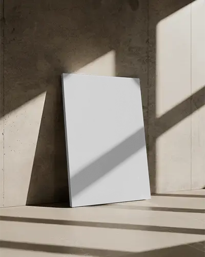 leaning-canvas-mockup-on-textured-stone-wall-with-strong-angled-sunlight-reflections