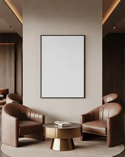 framed-canvas-mockup-between-leather-armchairs-with-round-golden-table-in-modern-lounge