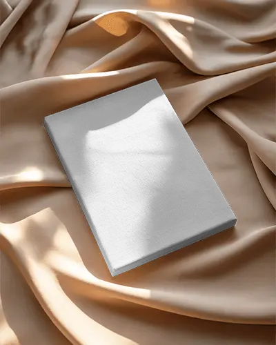 Flatlay Canvas Mockup On Beige Satin Fabric Folds