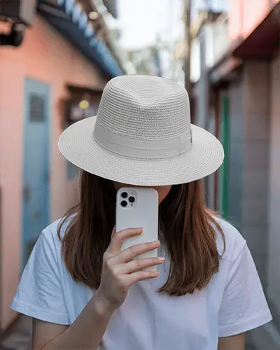 Casual Street Style Cap Mockup On Person Capturing Photo With Mobile Device In Hand