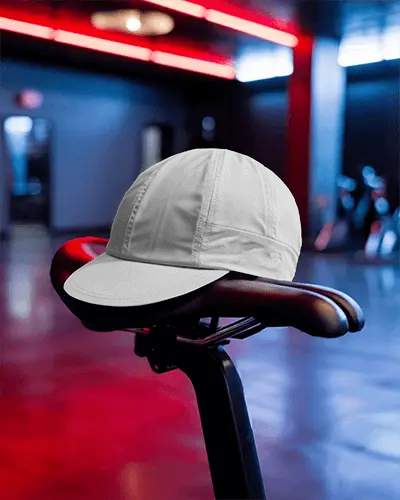 Indoor Gym Cycling Cap Mockup Balanced On Saddle With Glow Neon Light And Fitness Ambience