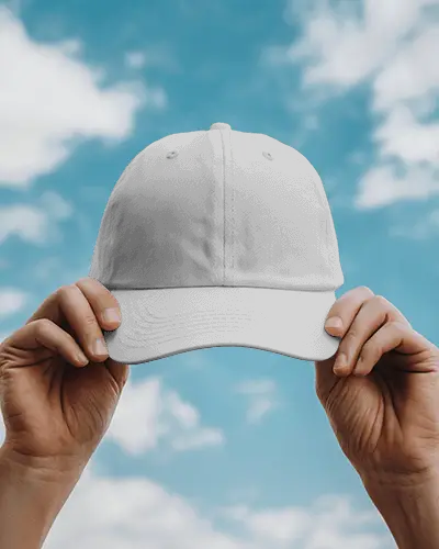 front-view-baseball-cap-mockup-hands-holding-black-cap-against-blue-sky-natural-lighting