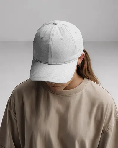 casual-cap-mockup-woman-in-oversized-beige-shirt-dark-baseball-hat-studio-look-modern-style
