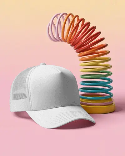 trendy-trucker-cap-mockup-dark-hat-with-mesh-back-against-colorful-spring-toy-pastel-scene
