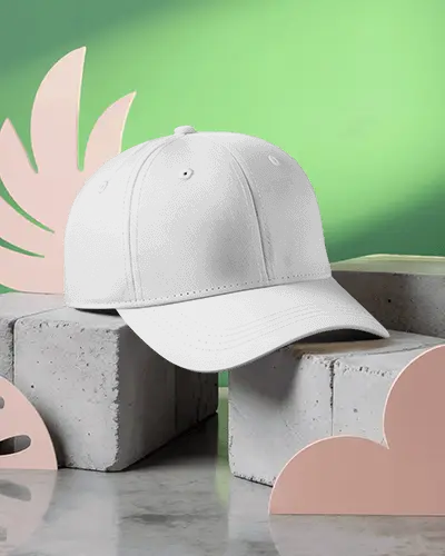 stylish-baseball-cap-mockup-dark-hat-on-concrete-blocks-green-background-modern-display