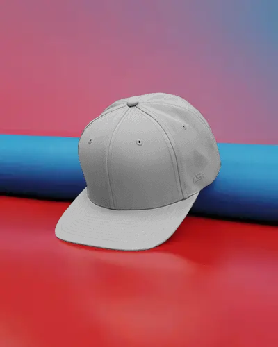 stylish-baseball-cap-mockup-on-red-surface-with-blue-roll-and-gradient-backdrop