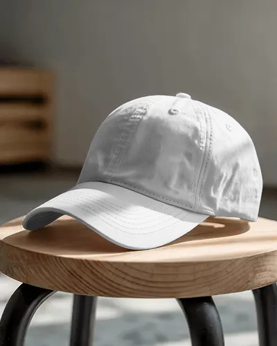 Everyday Style Cap Mockup On Wooden Stool In Bright Studio Setting Simple And Relaxed Look